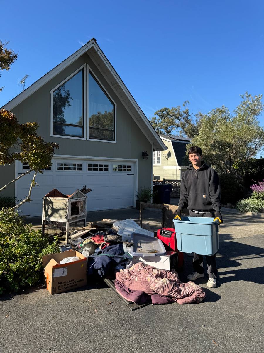 Before — driveway piled with junk